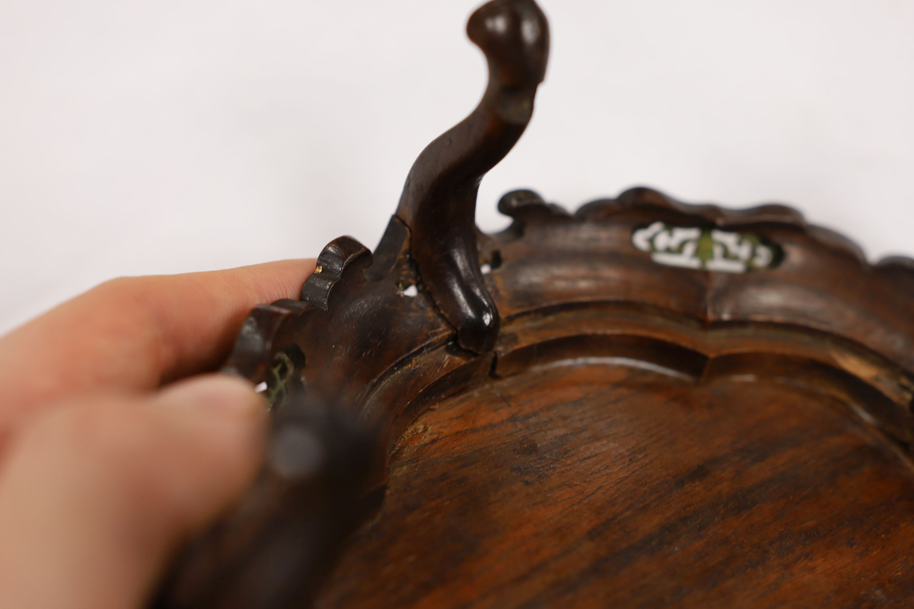 A fine Chinese oval hardwood and green stained Ivory inset stand, Qing dynasty, lacking stretcher, 15 cms wide.